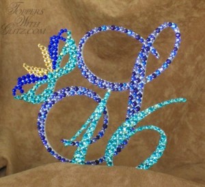 Mardi Gras Topper  Font: Vivica Colors: Cobalt, Lt Colorado Topaz (feathers), Blue Zircon, Blue Zircon AB (mask, 16), Heliotrope, Purple Velvet, Tanzanite (S)