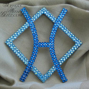 Crystal cake topper shaped like cattle brand